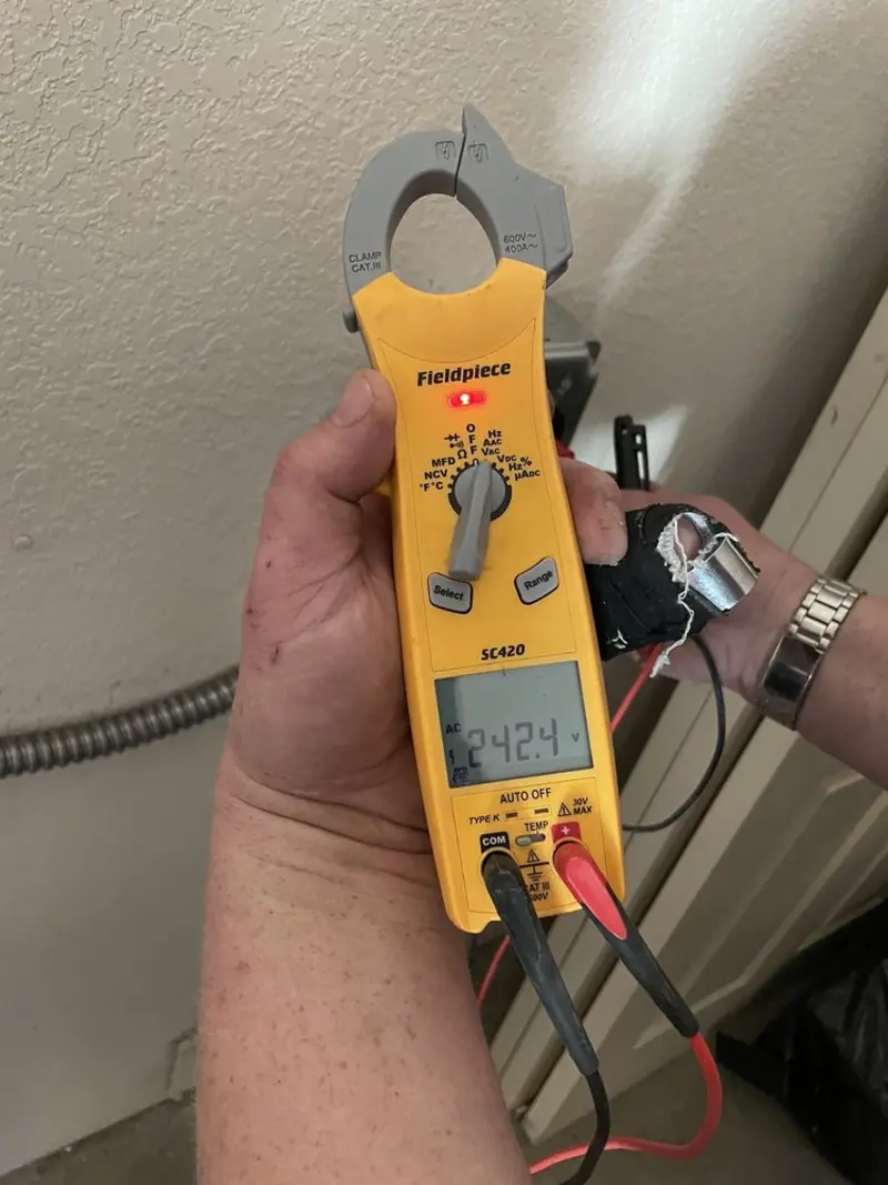 Voltage testing with clamp meter during Aluminum Wiring Replacement in Lago Vista